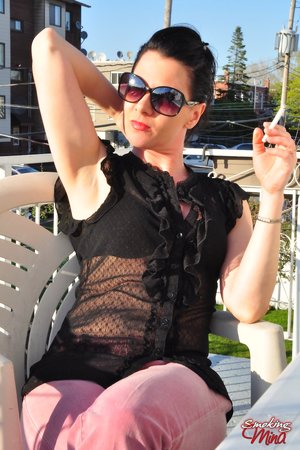 Smoking Mina offers a free xxx photo gallery with Mina unveiling nice form